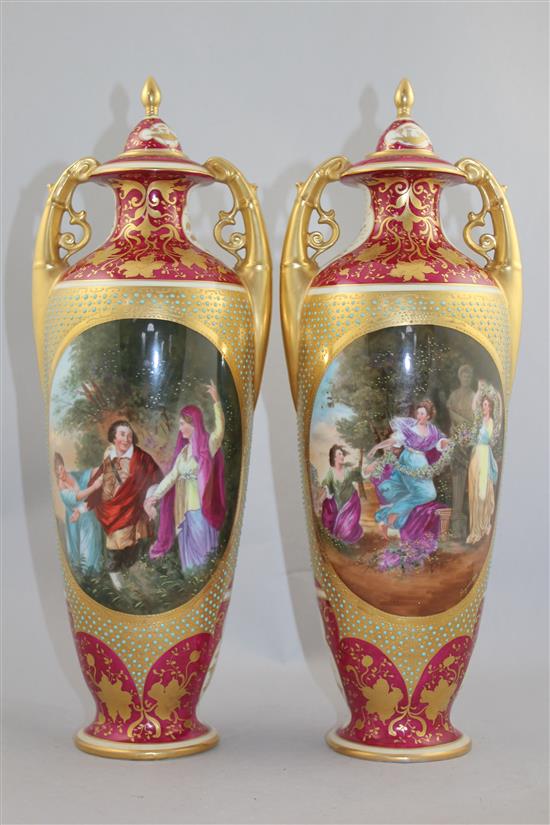 A pair of Vienna style porcelain twin handled vases and covers, c.1880-1900, 41.5cm, damages to cove